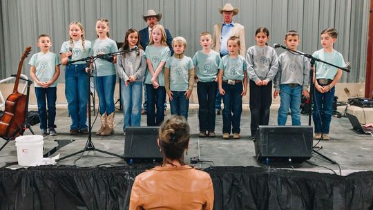 PHOTO COURTESY OF KATHERINE DRYE Students from Sunrise Christian Schoolhouse recite Bible verses for the audience.