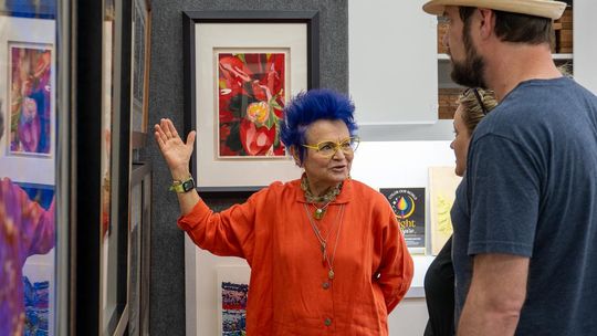 PHOTO BY DAVE WILSON Daryl Howard talks to studio visitors about her art, which is created with a Japanese woodblock printmaking technique.