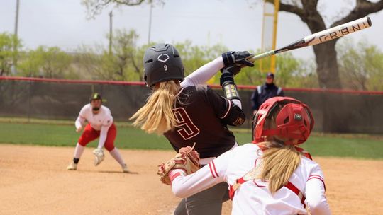 PHOTO BY CELESTE GAMBLE Alex Wiatrek hits a home run against Fredericksburg High School.