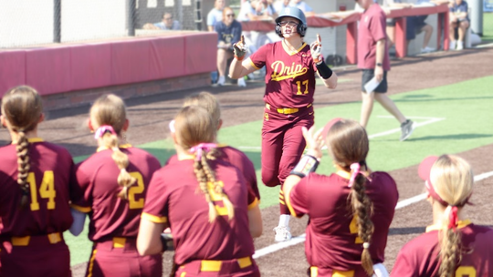 PHOTO BY CELESTE GAMBLE Lorelei Gamble heads to first base after hitting a home run.