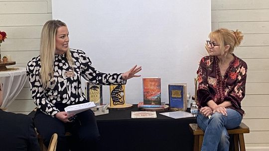 CONTRIBUTED PHOTO Moderator Kristen Currie, Morning Meteorologist at KXAN News in Austin, talks with author Elizabeth Crook.