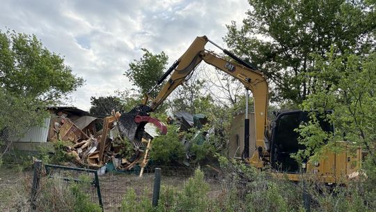 PHOTOS BY CHRIS KELKER-NEWLAN  Sunset Construction and Excavation was in charge of the demolition on March 30.
