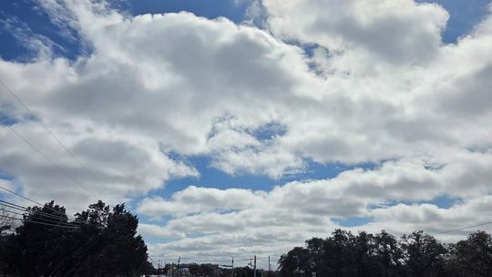 PHOTO BY KRISTI HAYNES  Ice covers Ranch Road 12 near the intersection of Roger Hanks.