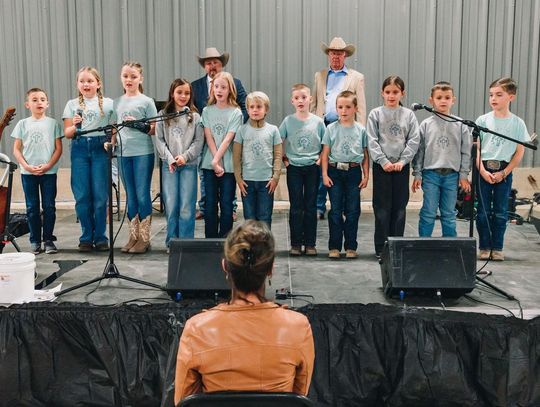 PHOTO COURTESY OF KATHERINE DRYE Students from Sunrise Christian Schoolhouse recite Bible verses for the audience.