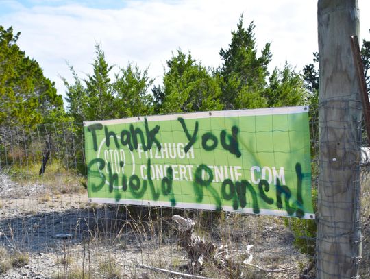 PHOTO BY LAURIE ANDERSON A new spray-painted message covers a Stop Fitzhugh Concert Venue sign.
