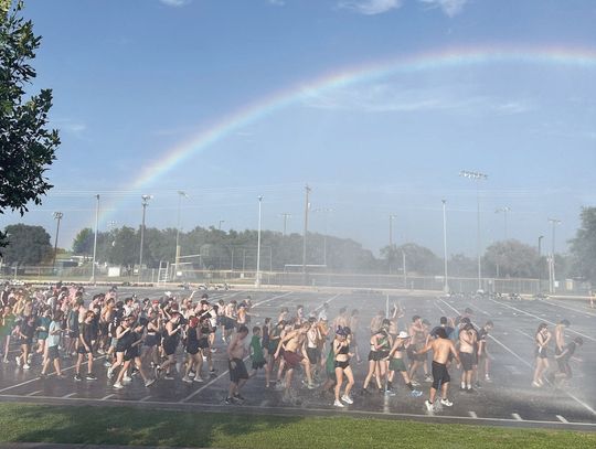 Firefighters spray down DSHS Marching Band after hot practice