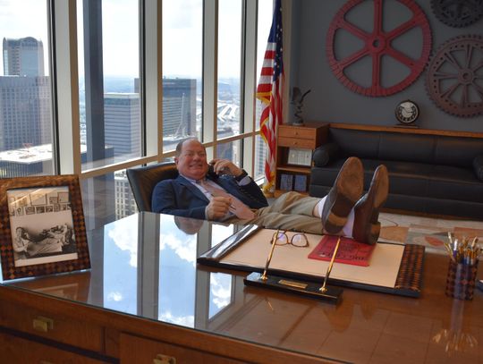 CONTRIBUTED PHOTO Jordan Cowman kicks back at his desk at his law firm in Dallas.