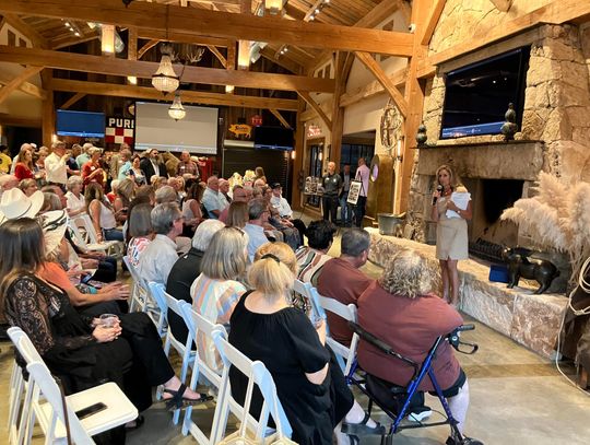 PHOTO BY JOHN PACHECO  Hometown Missions Director Janice Englehart welcomes guests to the third annual Strong Foundations fundraiser held at Hog Heaven. 
