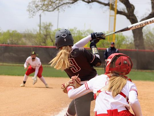 PHOTO BY CELESTE GAMBLE Alex Wiatrek hits a home run against Fredericksburg High School.