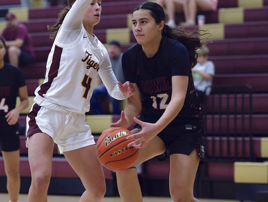 PHOTO BY VINCE CURLETTA Avery Ames (#4) guards a Bowie player in Friday's game.