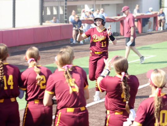 PHOTO BY CELESTE GAMBLE Lorelei Gamble heads to first base after hitting a home run.