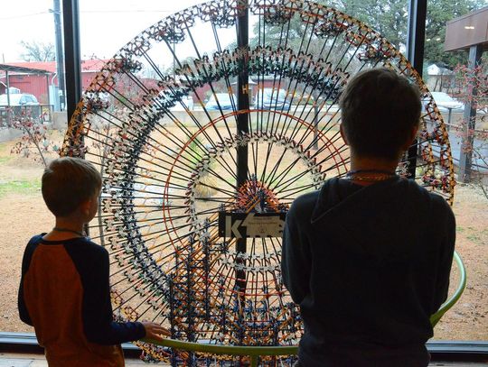 CONTRIBUTED PHOTO Two students check out an exhibit at the Science Mill.