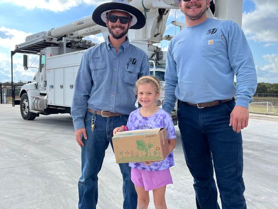 PEC lineworkers help Cypress Springs students put egg-drop designs to the test