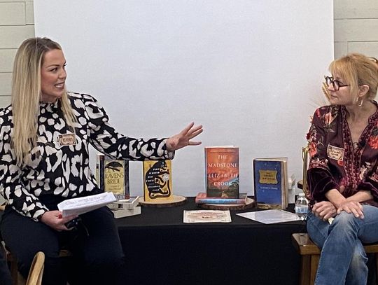 CONTRIBUTED PHOTO Moderator Kristen Currie, Morning Meteorologist at KXAN News in Austin, talks with author Elizabeth Crook.