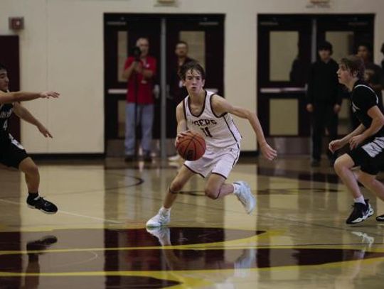 Tiger basketball splits first two district games