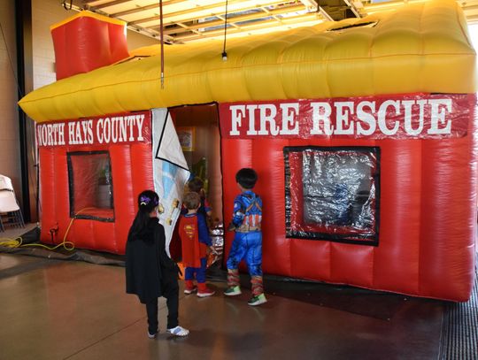 PHOTO BY LAURIE ANDERSON Kids enter the inflatable house for a fire safety lesson.
