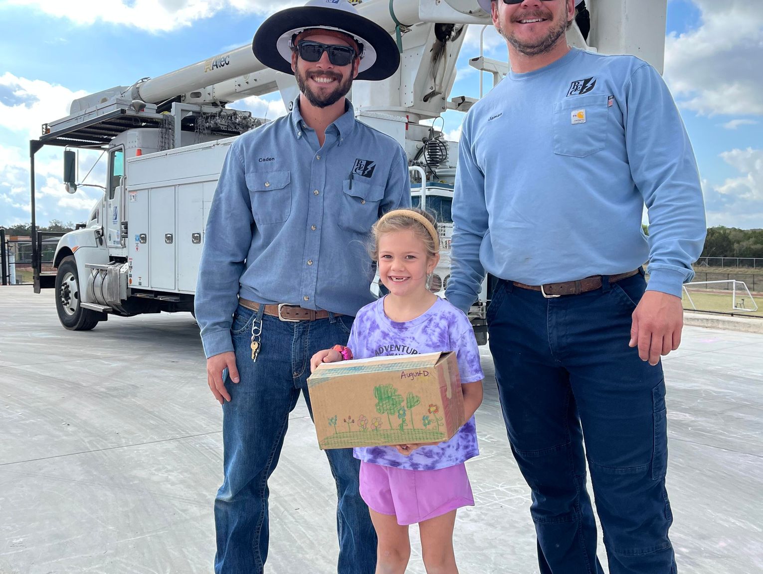 PEC lineworkers help Cypress Springs students put egg-drop designs to the test