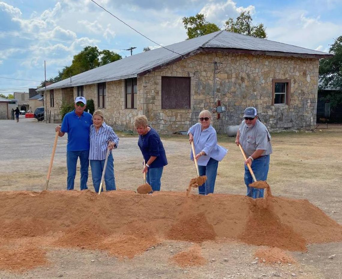 PHOTO BY STEPHANIE HARTNETT  Community members who attended school in the Stephenson Building participate in the ground-breaking ceremony.