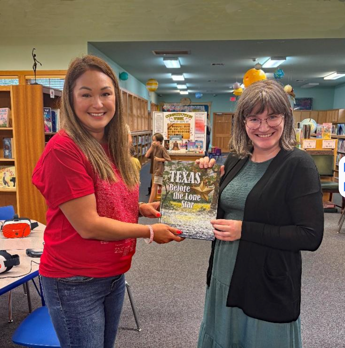 CONTRIBUTED PHOTO Jessica Rodriguez, Regent of the Sarah Pound Chapter NSDAR, presents the book to Children’s Librarian Olivia Ochoa.
