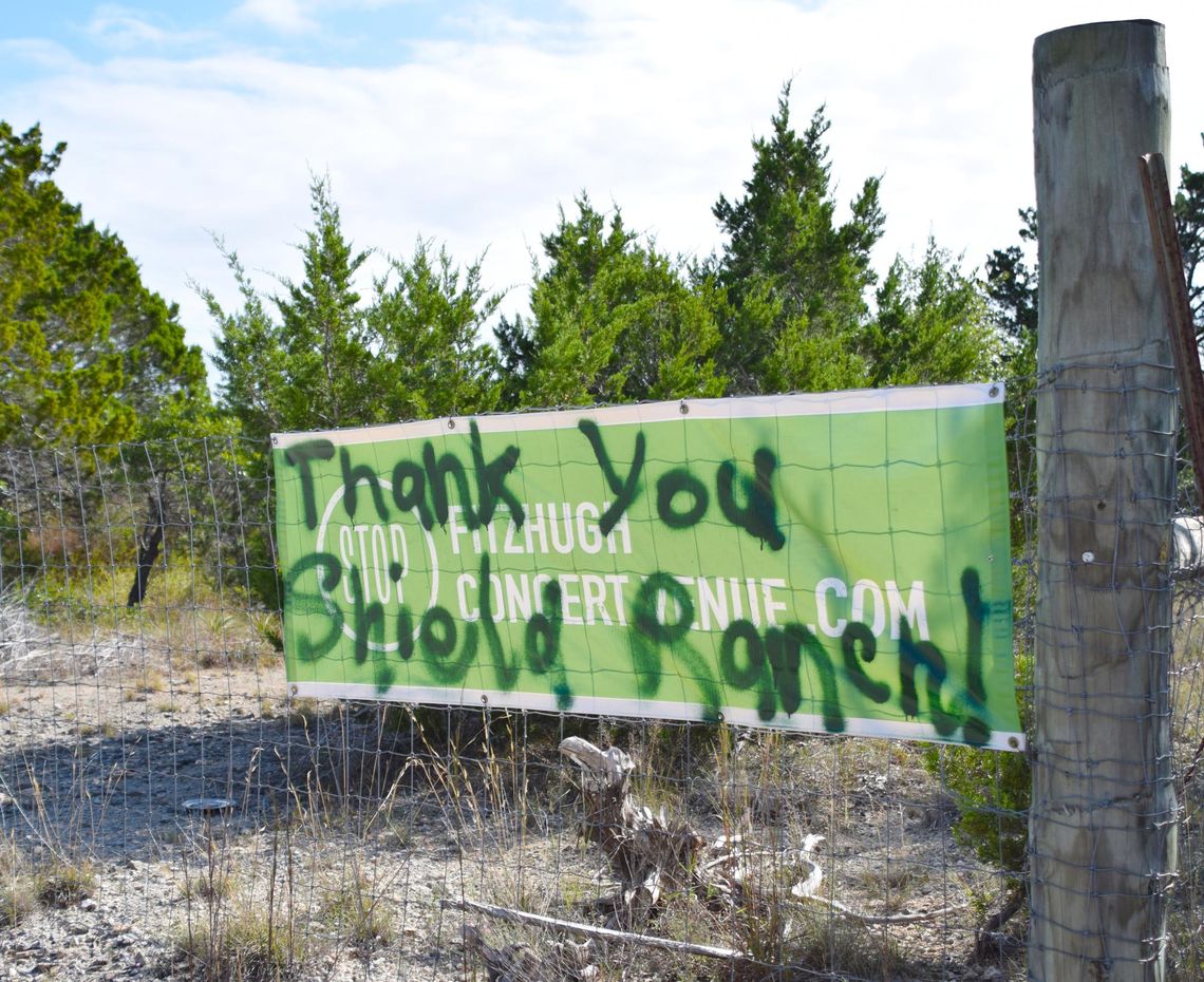 PHOTO BY LAURIE ANDERSON A new spray-painted message covers a Stop Fitzhugh Concert Venue sign.
