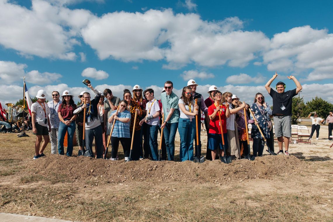 PHOTO COURTESY OF DRIPPING SPRINGS ISD DSISD trustees and students who will attend the new 18+ school break ground on the site.