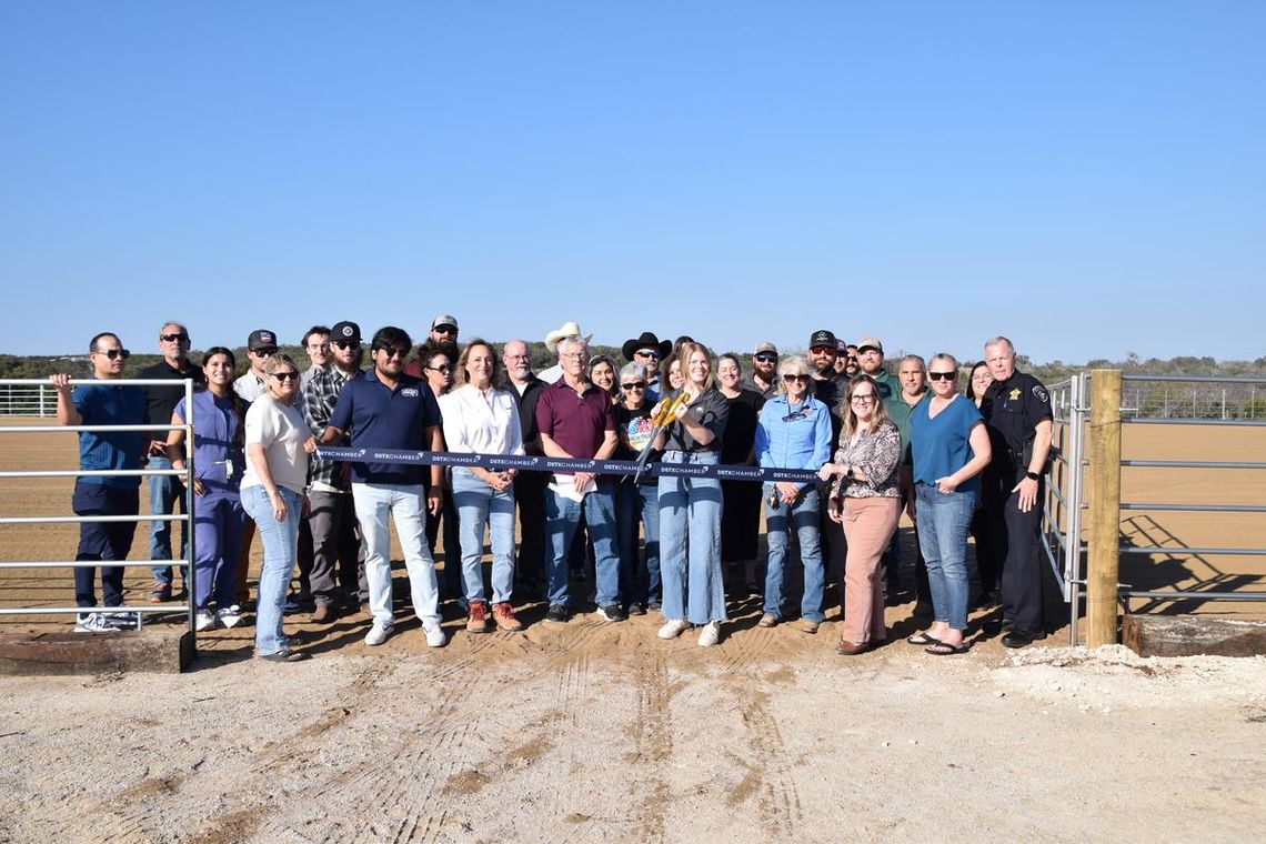 PHOTO BY LAURIE ANDERSON Dripping Springs Ranch Park manager Lily Sellers prepares to cut the ribbon at the new arena.