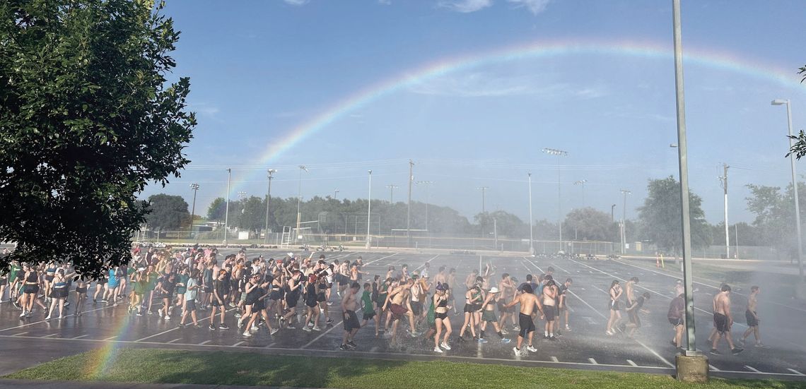 Firefighters spray down DSHS Marching Band after hot practice