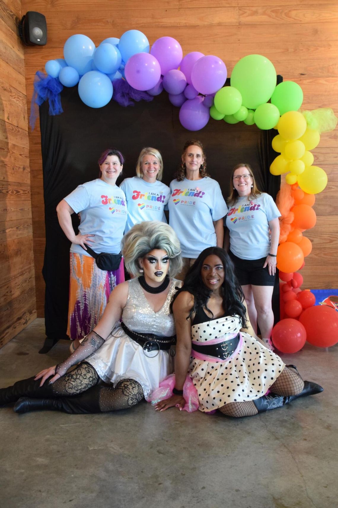 ‘Friends with Pride’ offers allies way to support local organization PHOTO BY LAURIE ANDERSON Pride of Dripping Springs board members Julie Balderramas, Jennifer Gamewell, Cynra McGuire and Nichole Newlan take a photo with Maxine LaQueene and Simone Jewel Riviera, who hosted Drag Queen Bingo.