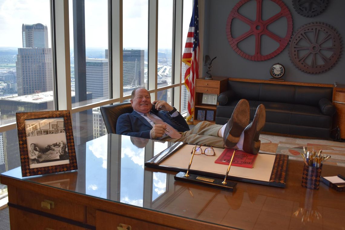 CONTRIBUTED PHOTO Jordan Cowman kicks back at his desk at his law firm in Dallas.