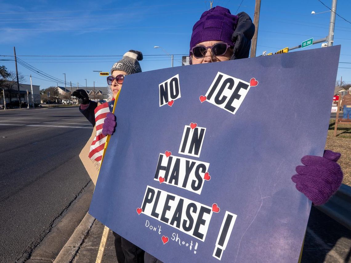 PHOTO BY DAVE WILSON About 20 protesters gathered at the junction of Highway 290 and RR12 in Dripping Springs on Jan. 10, after  the killing of Renee Good by ICE agents in Minneapolis the previous Wednesday.