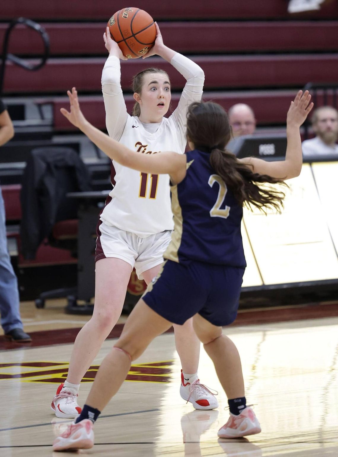 PHOTO BY VINCE CURLETTA  Ella Beatty (#11) looks for an open player to pass to in Friday night's game against Akins.