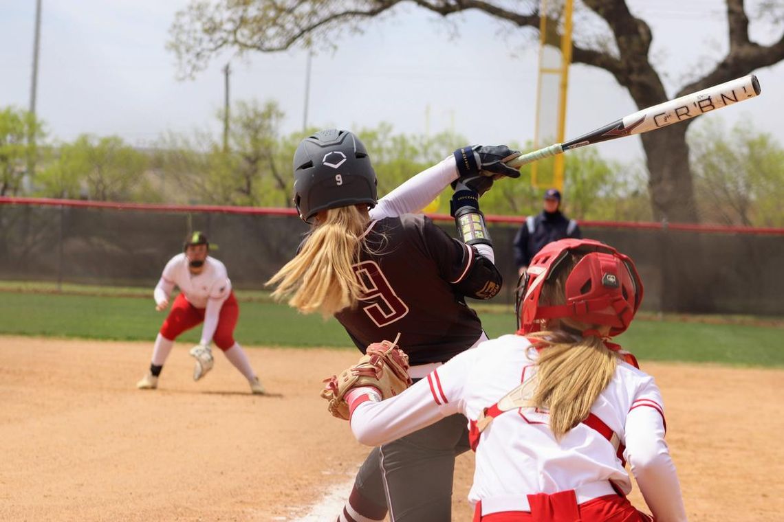 PHOTO BY CELESTE GAMBLE Alex Wiatrek hits a home run against Fredericksburg High School.