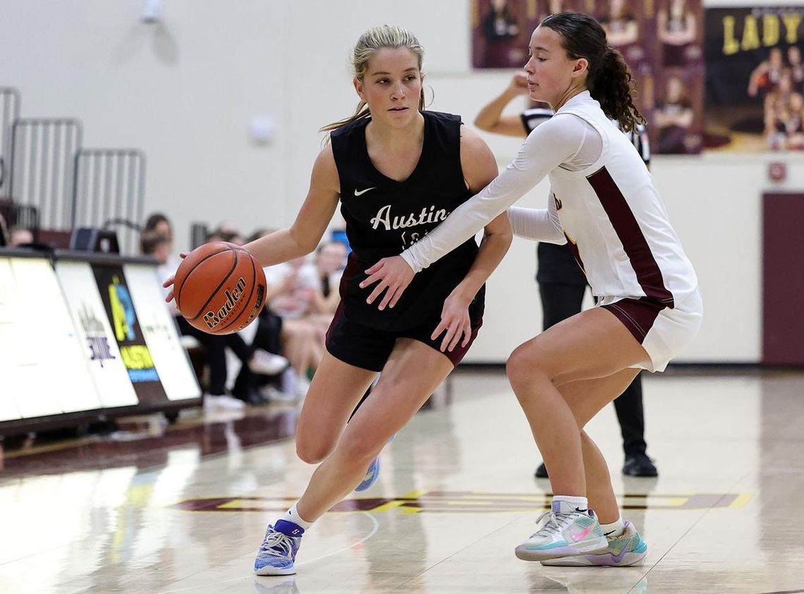 Lady Tigers eked out by Lady Maroons PHOTO BY VINCE CURLETTA Avery Ames (#4) reaches for the ball in Tuesday's game against Austin