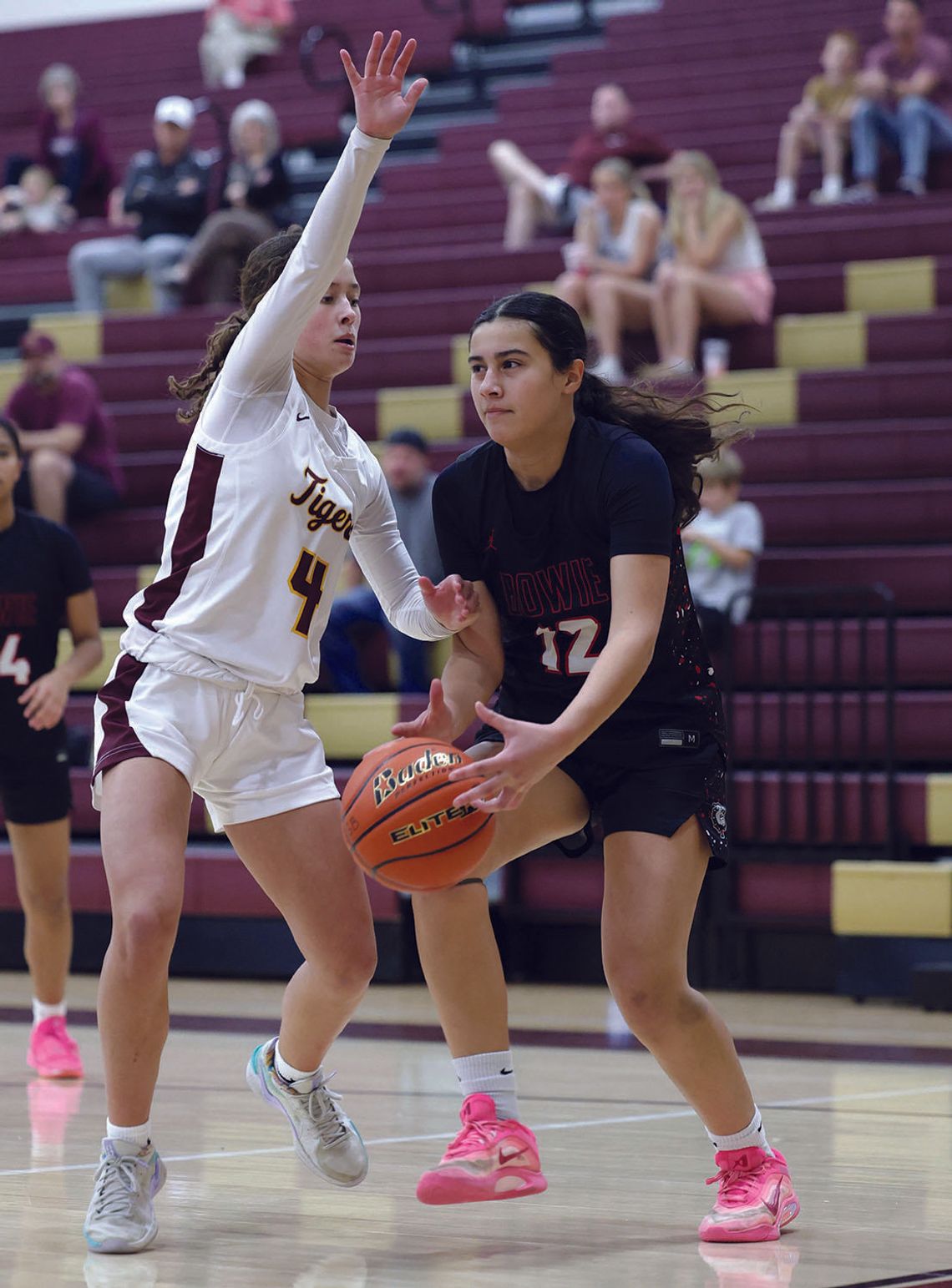 PHOTO BY VINCE CURLETTA Avery Ames (#4) guards a Bowie player in Friday's game.