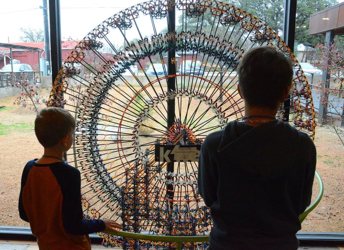 CONTRIBUTED PHOTO Two students check out an exhibit at the Science Mill.