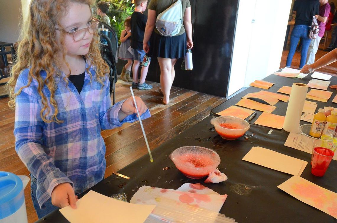 CONTRIBUTED PHOTO A museum guest participates in a hands-on science activity.