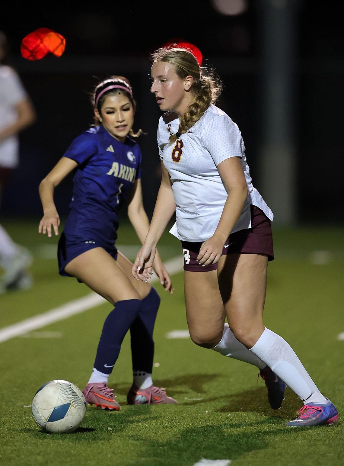 Vince Curletta Daisy Kaner (#8) keeps the ball from an Akins player.