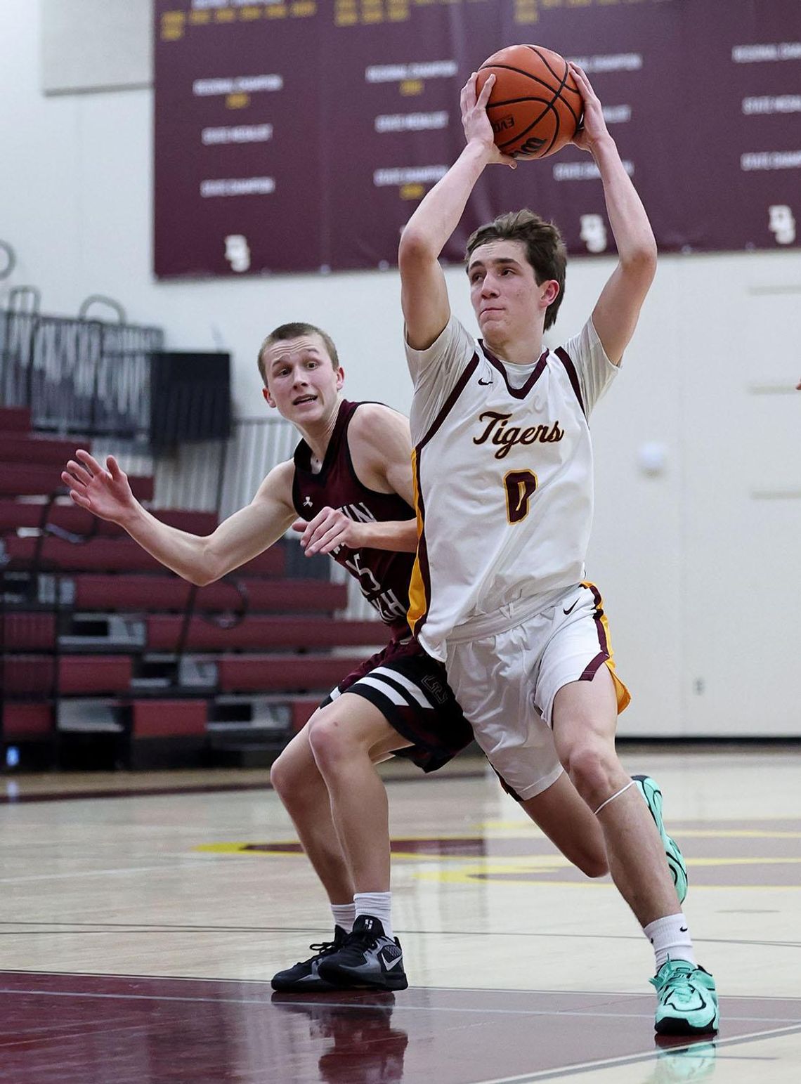 Tigers drop final two PHOTO BY VINCE CURLETTA Rushton Budge (#0) fights past an Austin High School defender in Tuesday's game