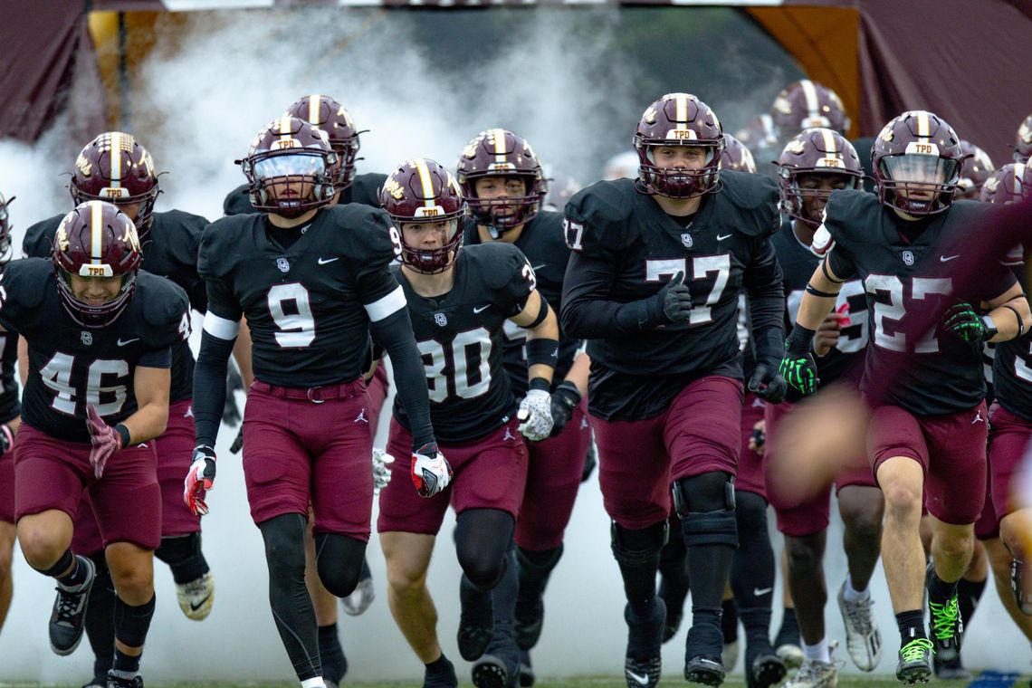 Tigers pass the test for 45-14 win over Panthers PHOTO BY CORTNI REID The Tigers run onto the field for Game 3.