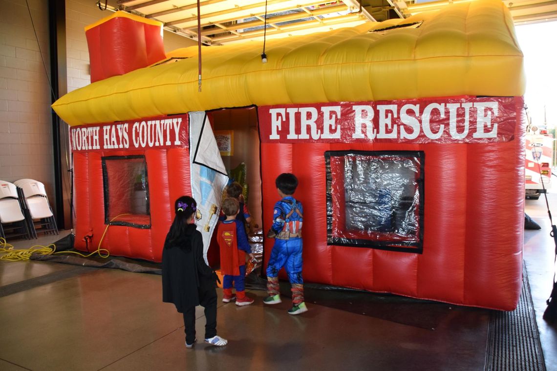 PHOTO BY LAURIE ANDERSON Kids enter the inflatable house for a fire safety lesson.