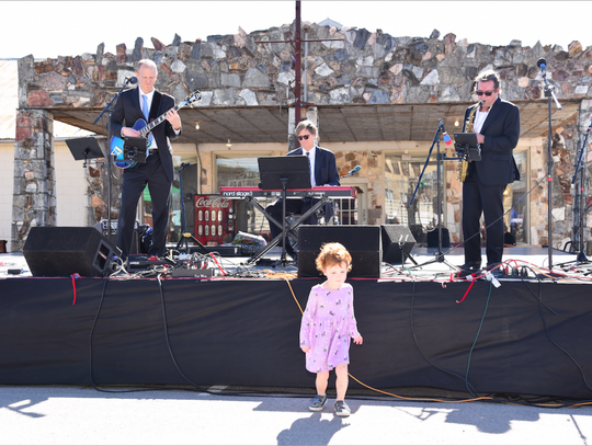 Isla Peichoto, age 3, danced to the music of the Buzz & the Blue Cats during their time on stage.