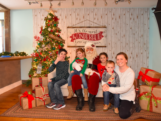 The Willis family stopped by to visit with Santa at the Rotary event. From left to right: Brenden, Makynden, Santa, Kingsley, Grayson, and Stephanie (mom).