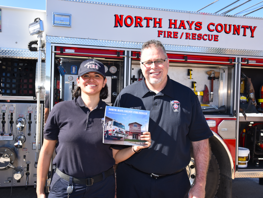 North Hays County Fire Rescue firefighters Cindy Lott and Lieutenant Rudolph were on hand to autograph North Hays Firefighters Calendars.