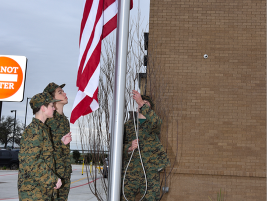 Flag raising ceremony by the DSHS ROTC Club