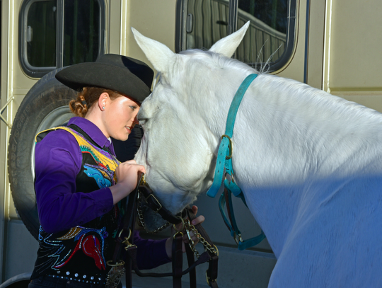 Leah Tate prepares her horse, Fancy, for the horse show section of the Hays County Livestock Show on Saturday at the Dripping Springs Ranch Park.