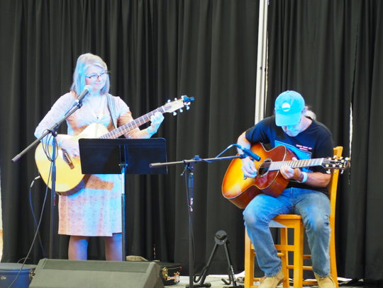 : Martha Pinto and her husband, Jamie Kinscherff, performed “Americana folk music,” on the festival music stage.