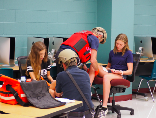 Members of North Hays Fire/Rescue treat simulated injuries.