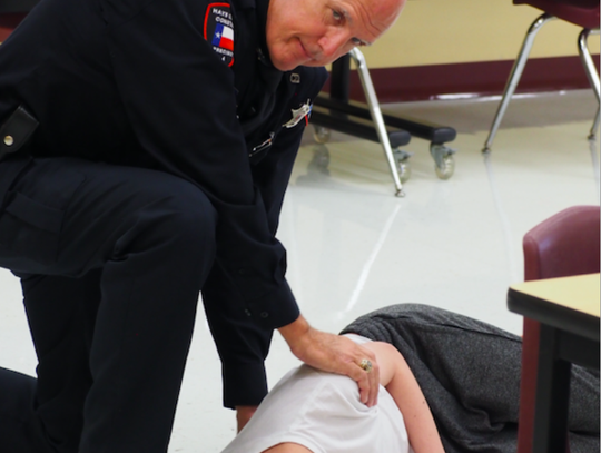 Pct. 4 Deputy Jimmy Zuehlke attends a simulated victim.