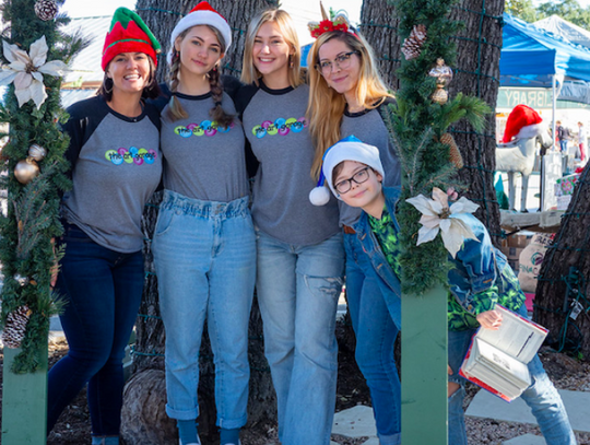 Staff from The Art Garage send Season's Greetings during Dripping Springs "Christmas on Mercer" event, Saturday, December 7th, 2019.