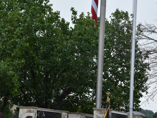 Old Glory is lowered to half-staff in honor of the victims of the 9/11 atttacks.